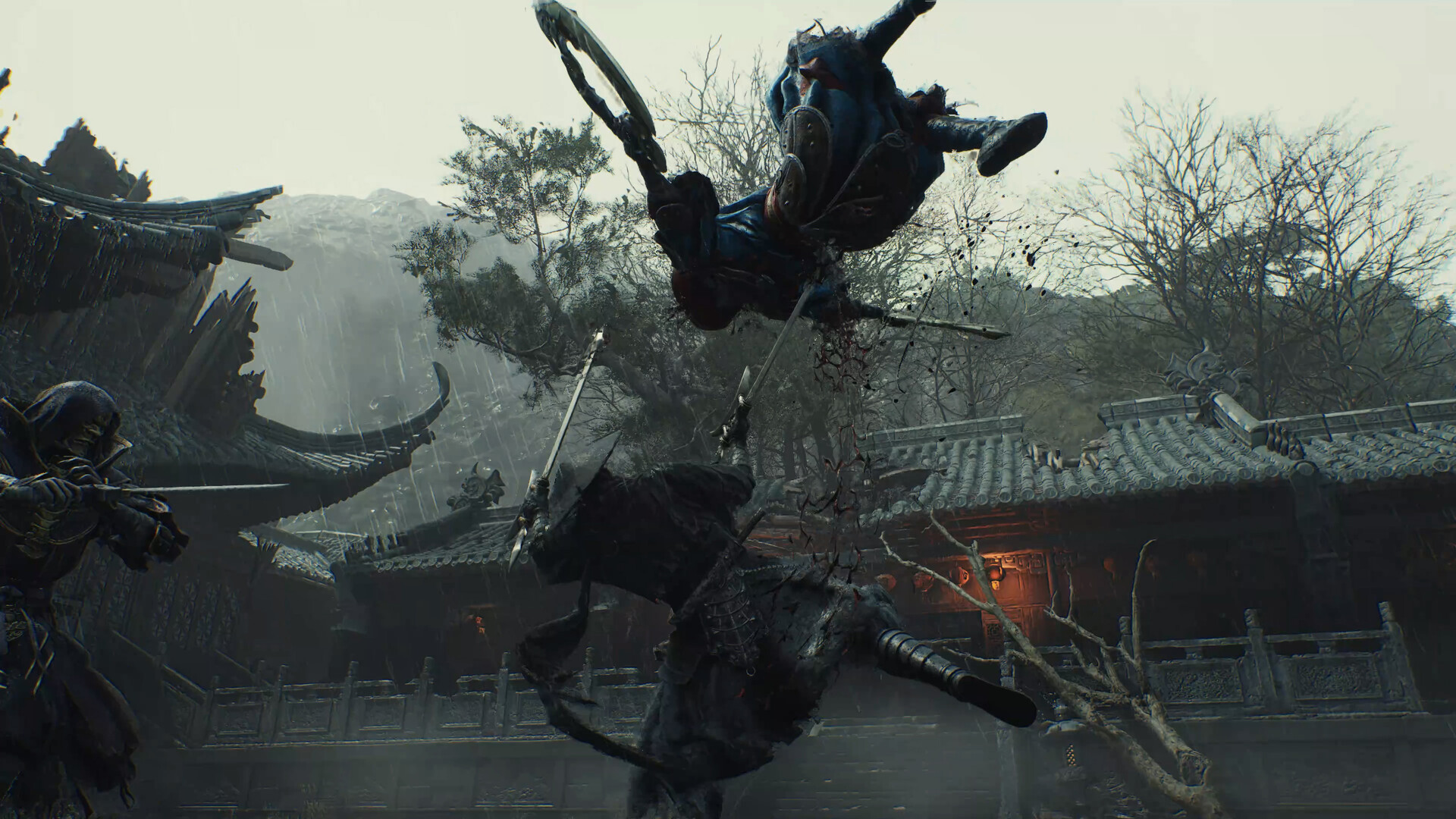 Rain over a wuxia courtyard: a blue-clad fighter inverted in the air above a dark-armored opponent, with tiled roofs and mountains behind.